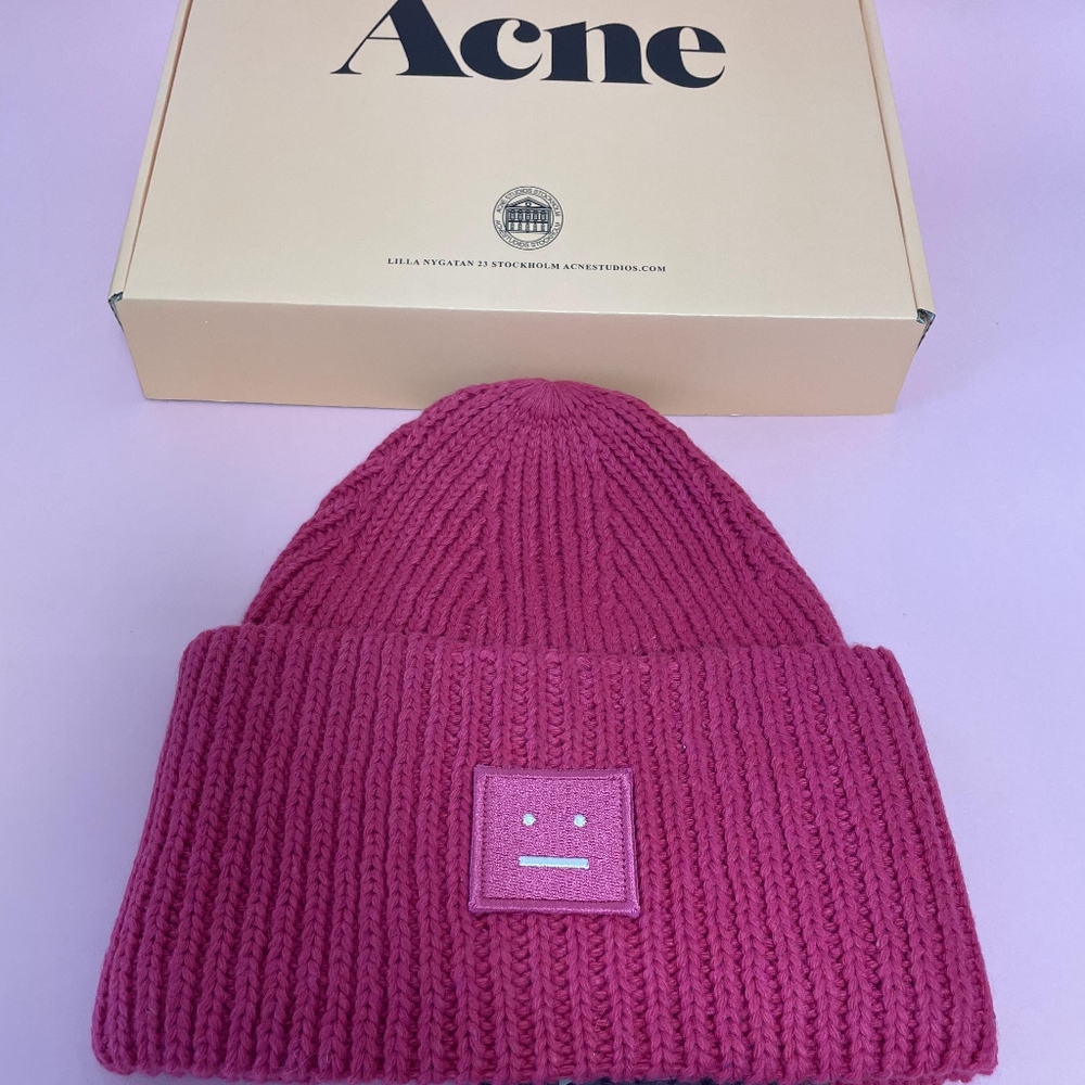 Complete Your Winter Look with a Pink Beanie and Acne Beauty Essentials